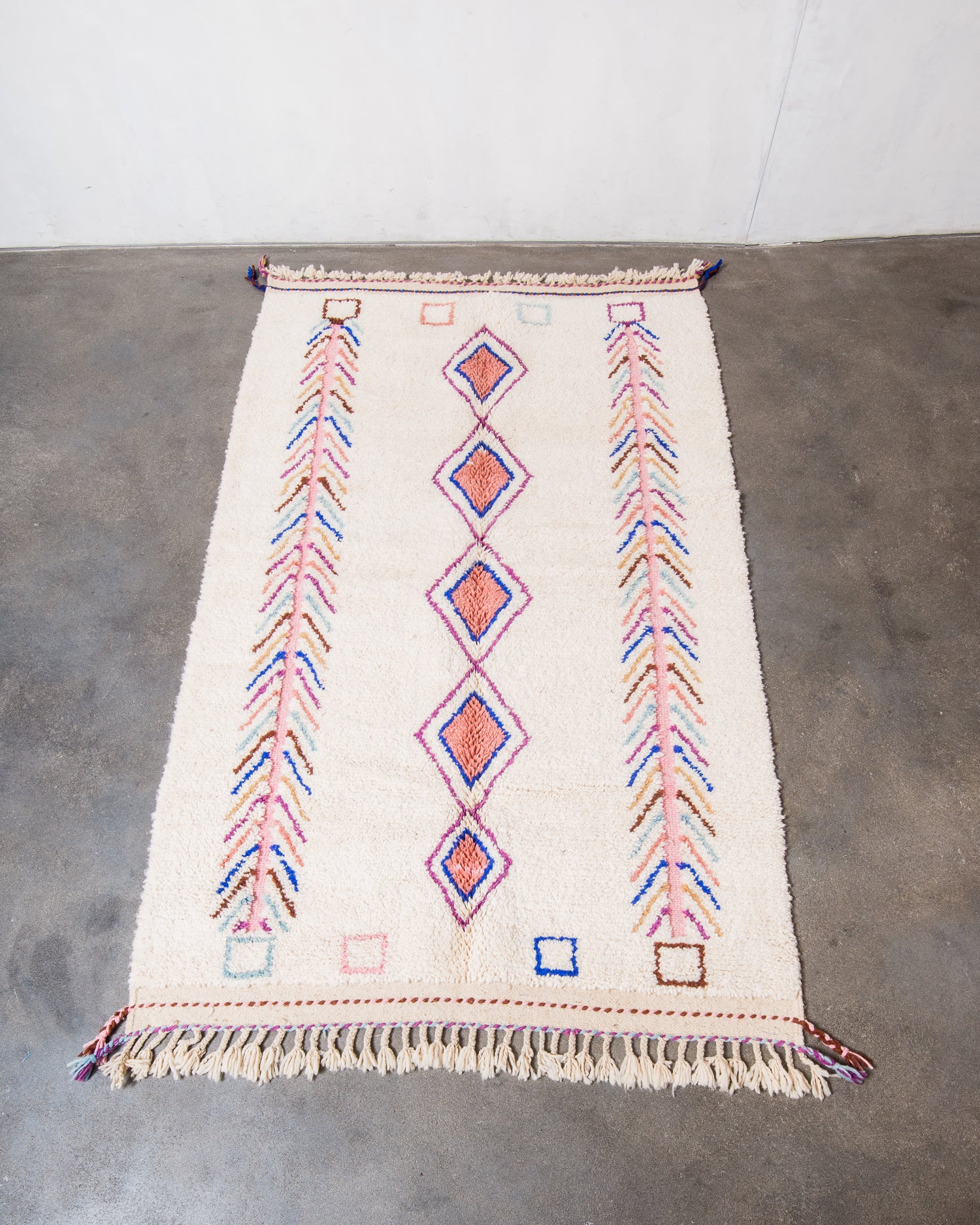 Modern, designer, handcrafted Berber rug from Morocco. Beniourain carpet with beautiful colours and patterns and fluffy wool texture.